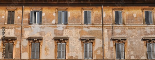 Old building facade with windows in a row