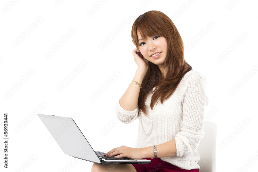 Beautiful asian woman using a laptop computer Beautiful asian woman using a laptop computer