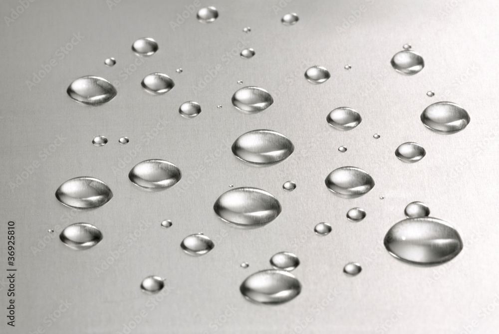 Abstract. Water droplets over steel background Abstract. Water droplets over steel background