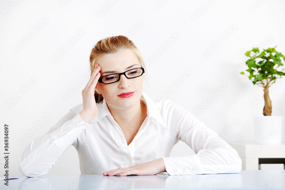 Beautiful woman in the office having headache. Beautiful woman in the office having headache.