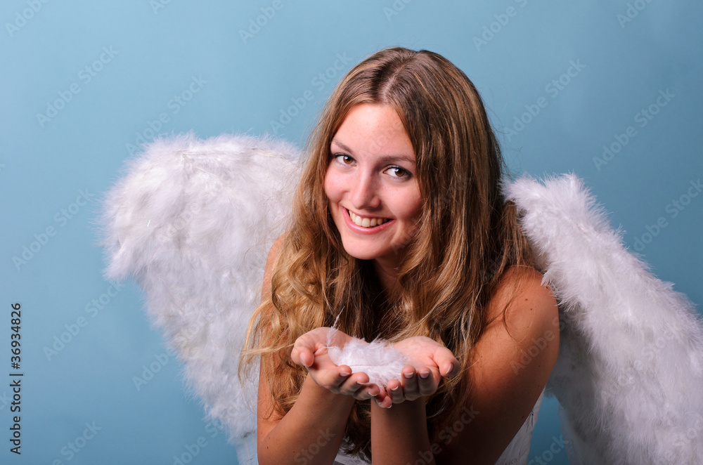 Christmas angel with delicate white feathers Christmas angel with delicate white feathers