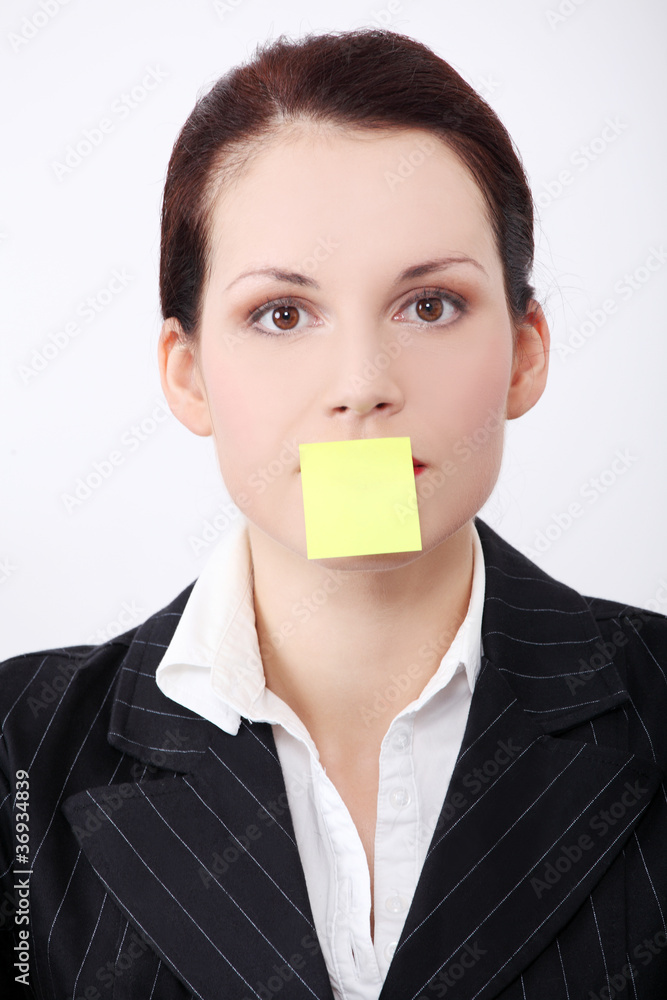 Woman`s with post it note on her mouth closeup. Woman`s with post it note on her mouth closeup.