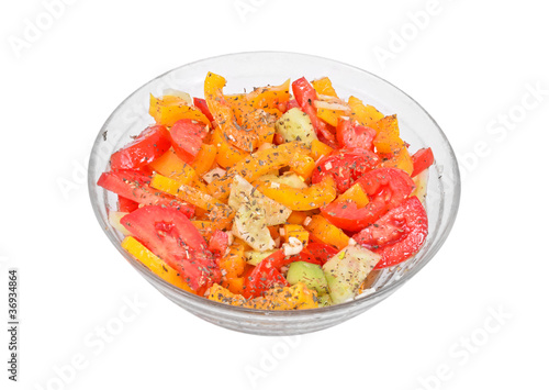 Fresh salad in a bowl, isolated on a white background