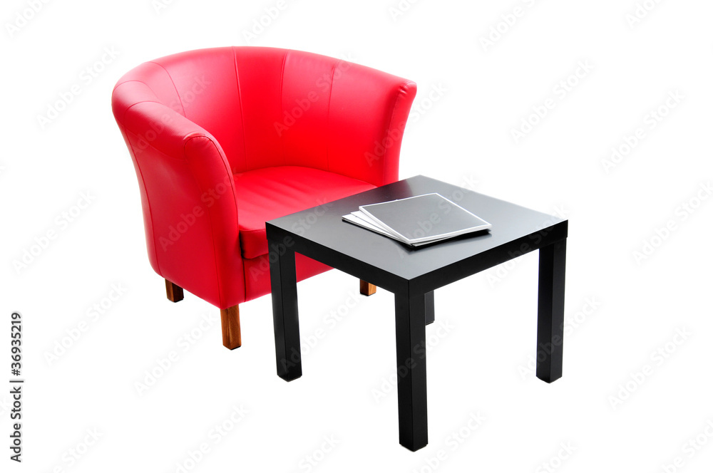 Red armchair and black table isolated on the white background. Red armchair and black table isolated on the white background.