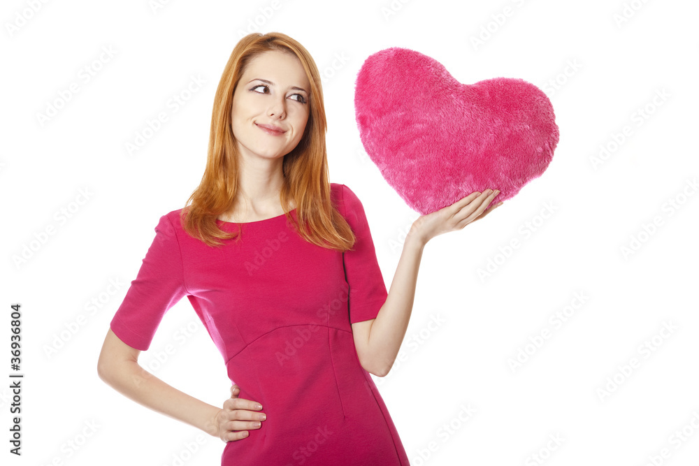 Beautiful red-haired girl with toy heart Beautiful red-haired girl with toy heart