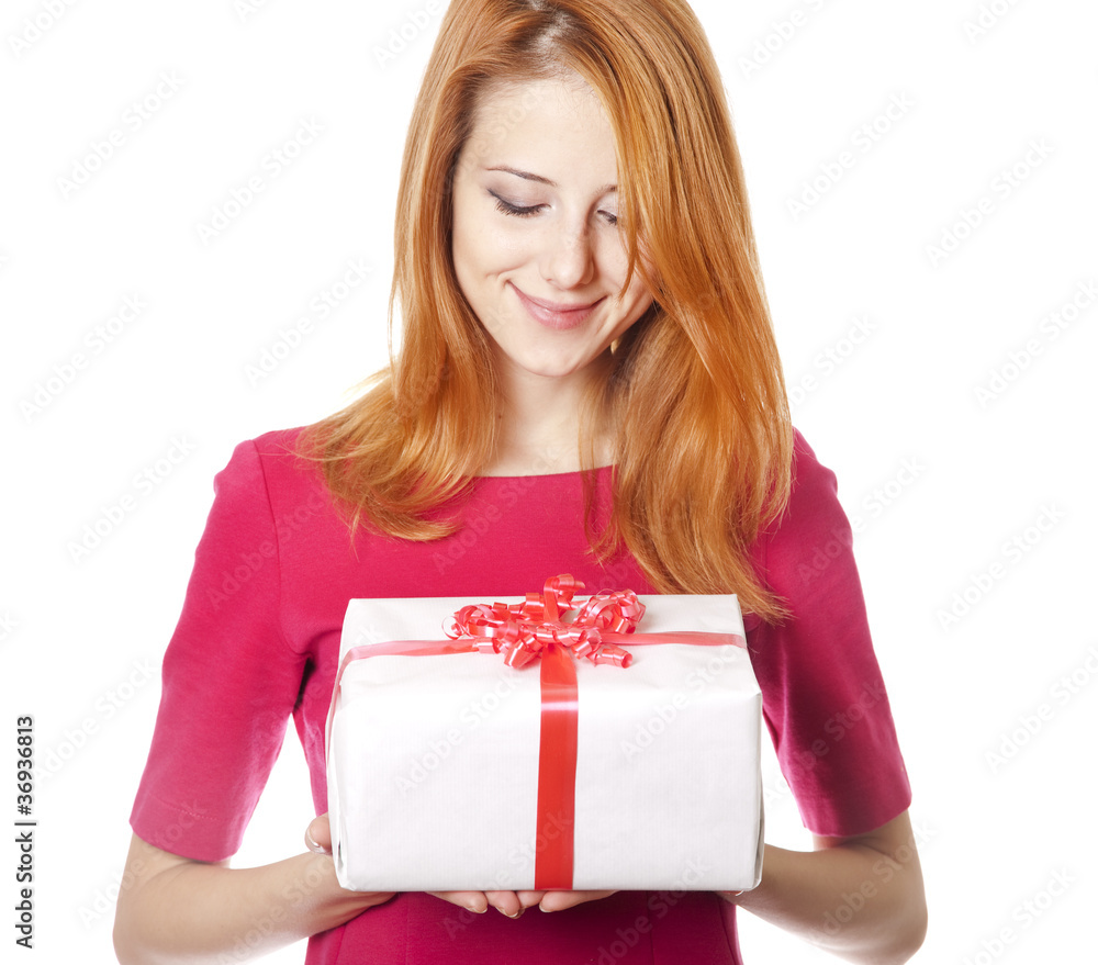 Red-haired girl in dress with present box Red-haired girl in dress with present box