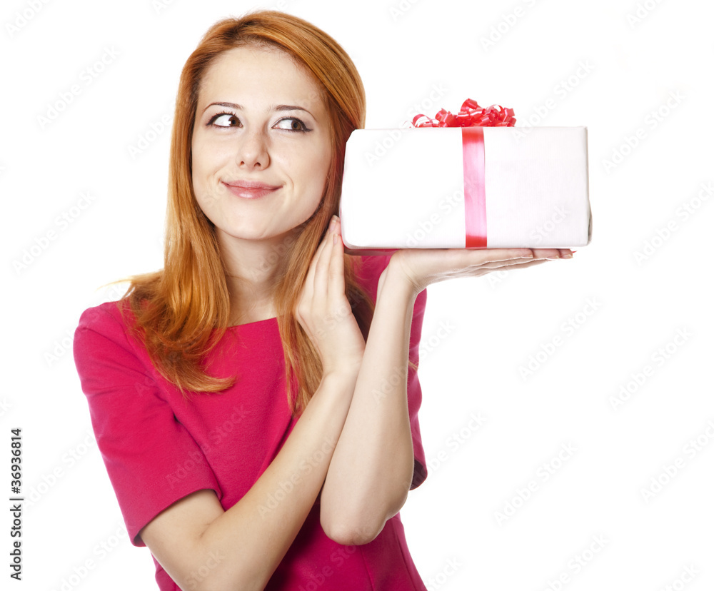 Red-haired girl in dress with present box Red-haired girl in dress with present box