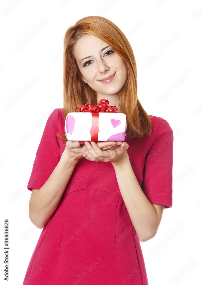 Red-haired girl in dress with present box Red-haired girl in dress with present box