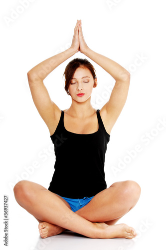 Teen girl practising yoga.