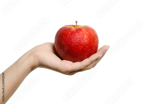hand holding and showing a perfect red apple