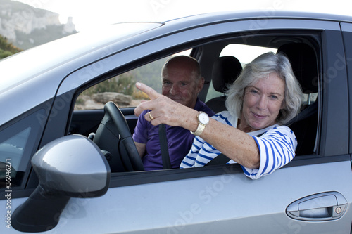 relaxed senior couple lost on the road