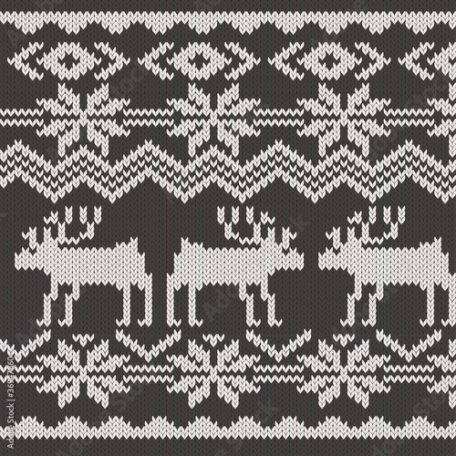 Knitted swatch with deers and snowflakes pattern