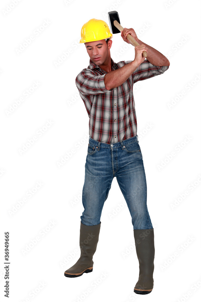 Man using a mallet Man using a mallet