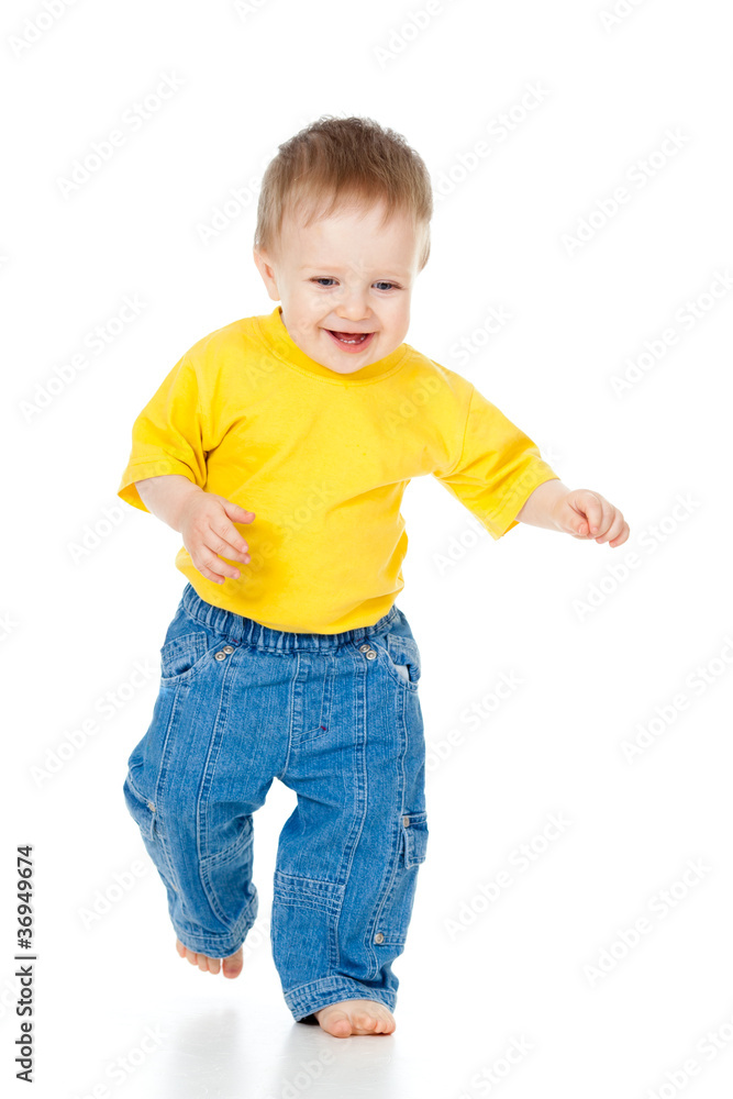 Fun baby boy running. Studio shot. Fun baby boy running. Studio shot.