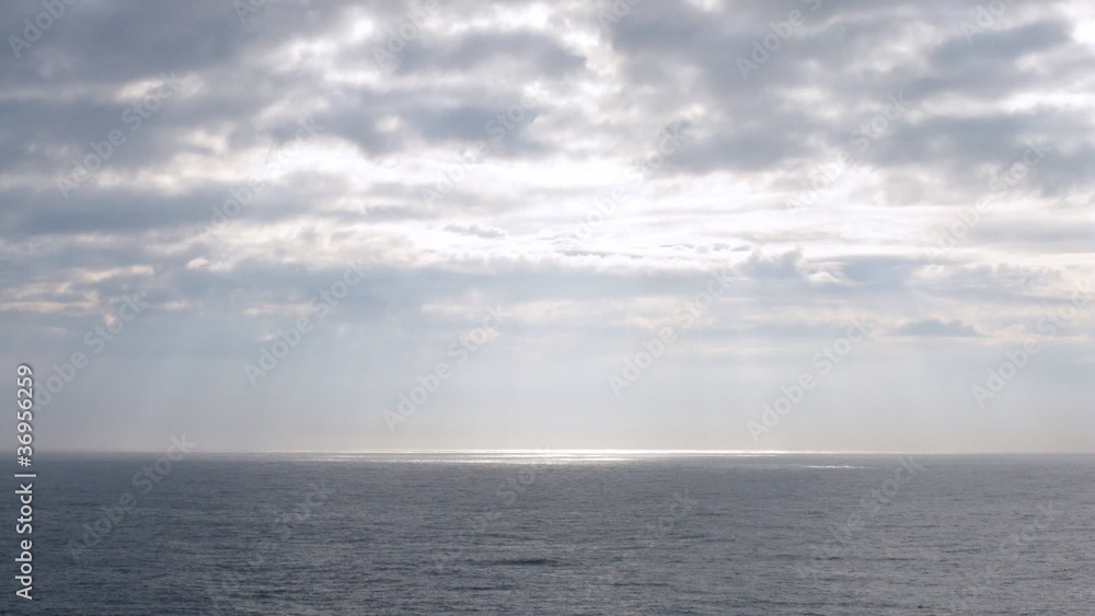 Light pass through clouds at sea, view from ship, time lapse Light pass through clouds at sea, view from ship, time lapse