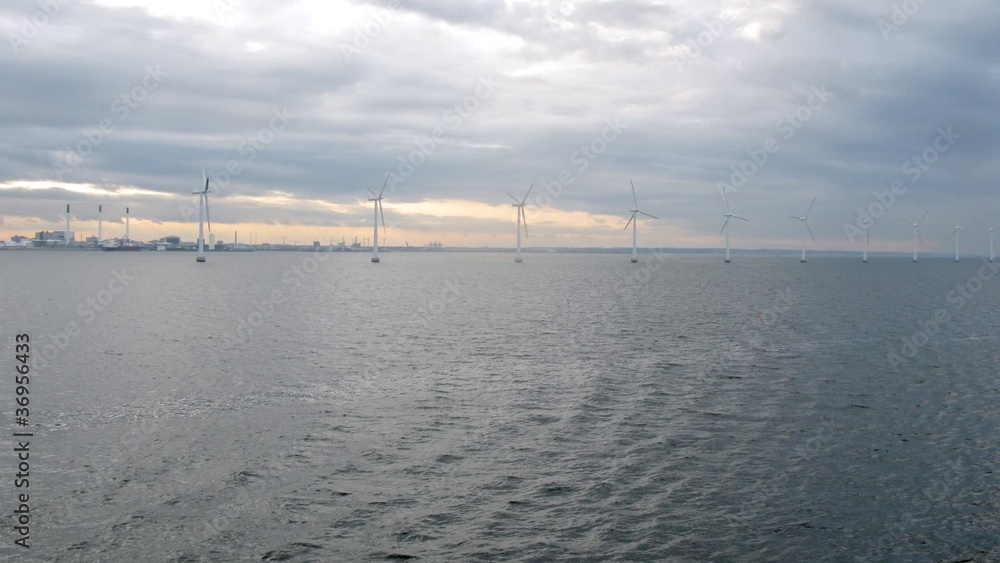 Pass by row of wind turbines, view from ship deck Pass by row of wind turbines, view from ship deck