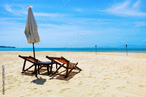 Two beach chairs on a tropical beach