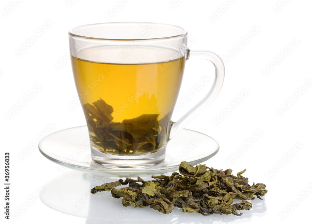 Green tea in glass cup isolated on white Green tea in glass cup isolated on white