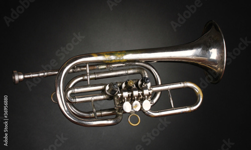 old trumpet on gray background