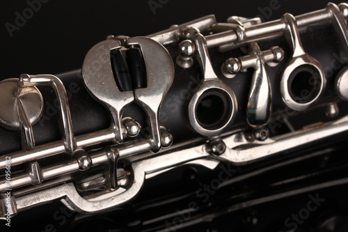 close up detail of clarinet on black background