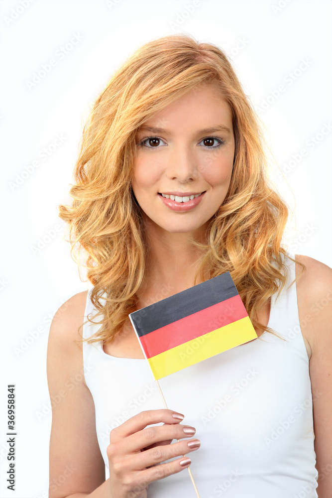 Pretty woman waving a German flag Pretty woman waving a German flag