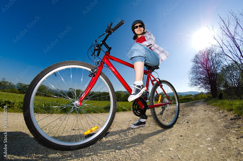 Fototapeta premium Girl riding bike