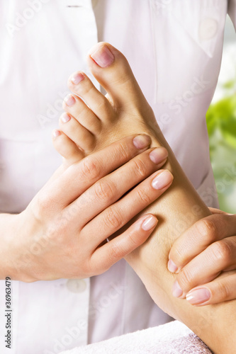 Foot massage in the spa salon