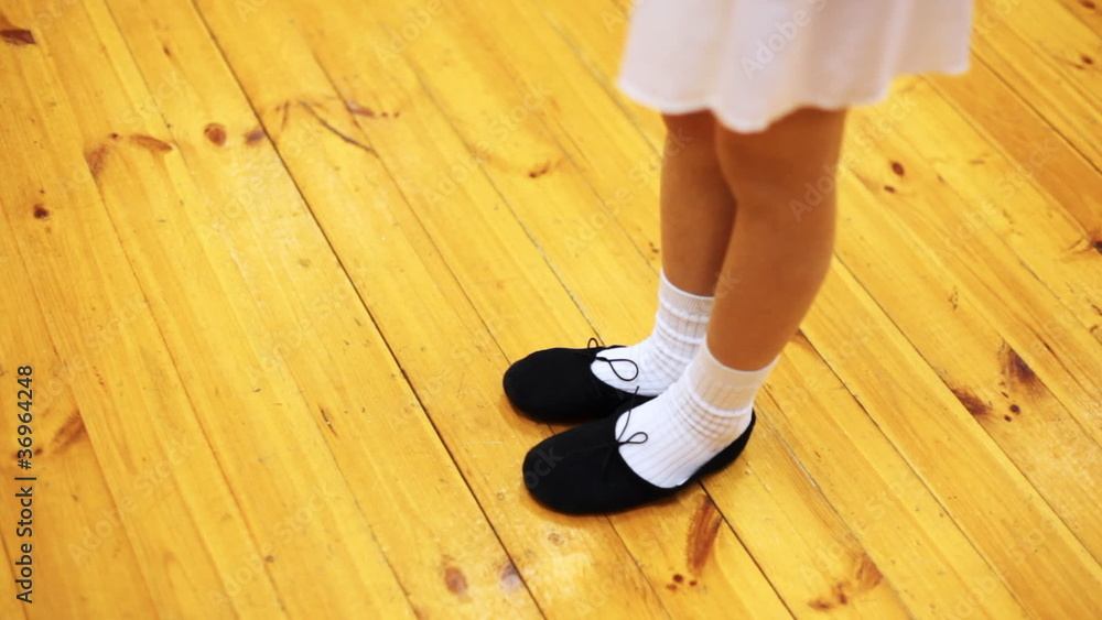 legs of girl doing ballet workout in movement while standing legs of girl doing ballet workout in movement while standing