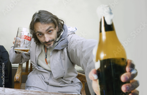 man with glass of beer