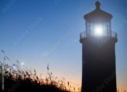 Canvas-taulu Light Shining in the North Head Lighthouse at Sunset