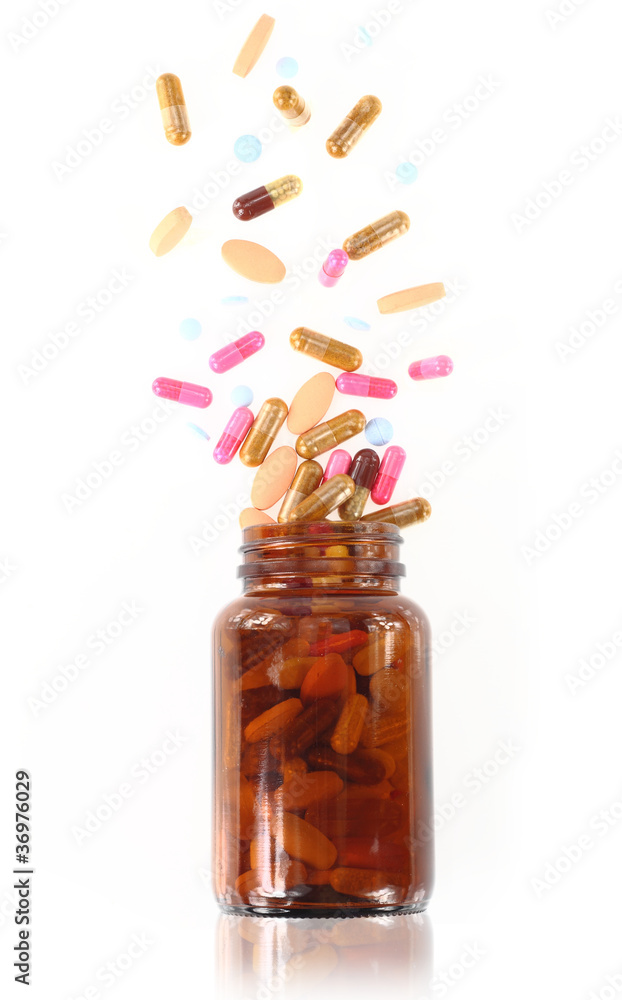 Pills come out from a medicine bottle Pills come out from a medicine bottle