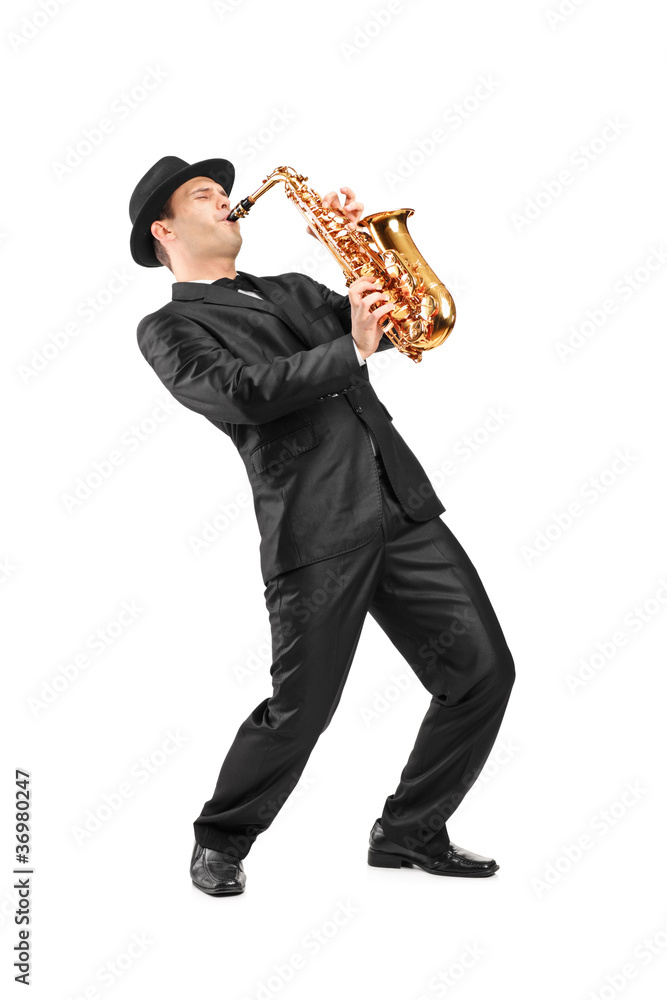Naklejka premium Portrait of a man in a suit playing on saxophone
