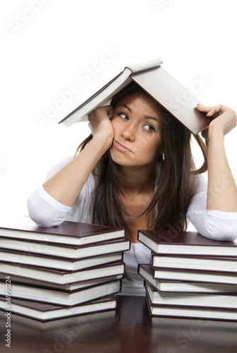 Girl tired of reading books studying school or college