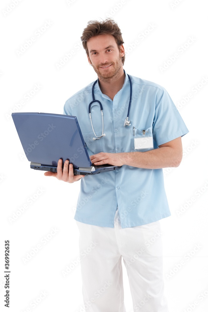 Handsome doctor with laptop smiling Handsome doctor with laptop smiling
