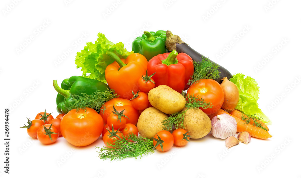 a set of fresh vegetables and greens on a white background