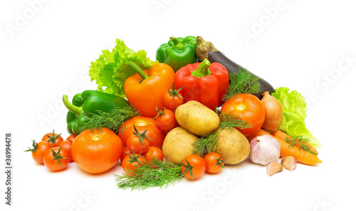 a set of fresh vegetables and greens on a white background