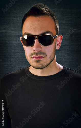 Fashion Guy with Glasses on Black background