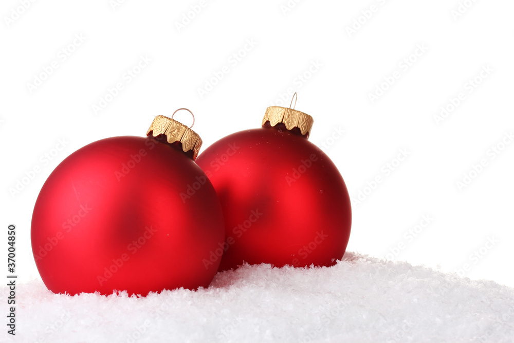 beautiful red Christmas ball in snow isolated on white beautiful red Christmas ball in snow isolated on white