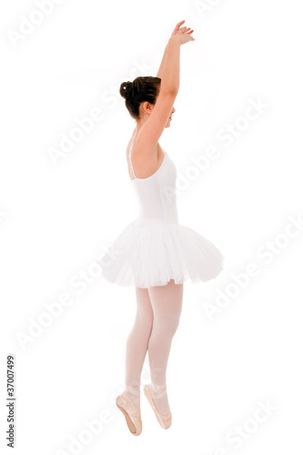 young and beautiful ballet dancer jumping on white background