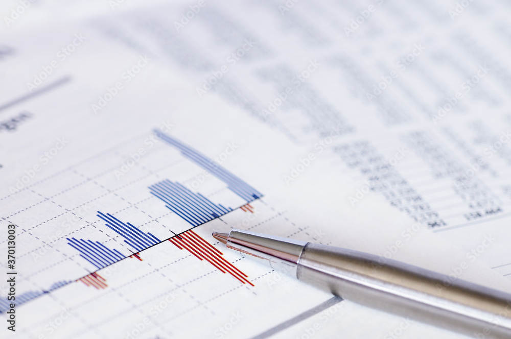 Financial planning with stock chart and pen. Financial planning with stock chart and pen.