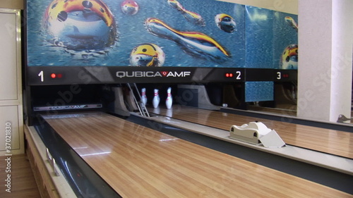 bowling ball knocks down pins
