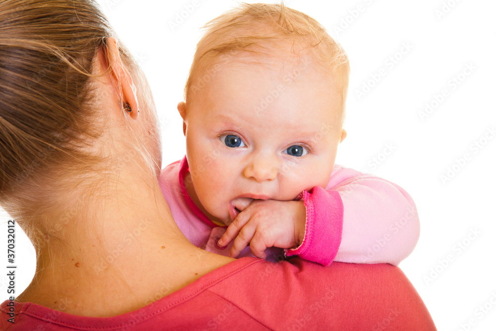 Mother holding infant baby girl isolated on white Mother holding infant baby girl isolated on white