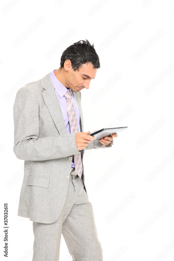 young business man standing using a tablet young business man standing using a tablet