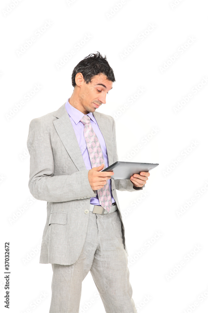 young business man standing using a tablet young business man standing using a tablet