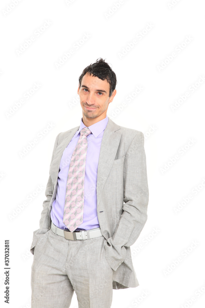 young business man standing with hands in pocket young business man standing with hands in pocket