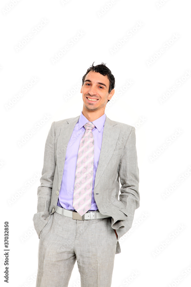 young business man standing with hands in pocket young business man standing with hands in pocket