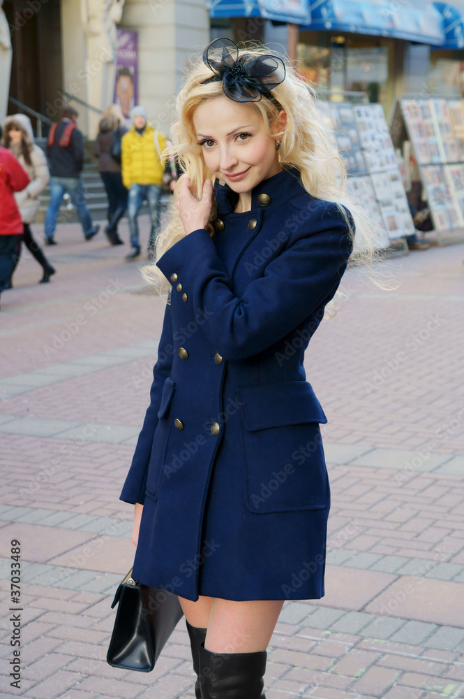 Young pretty blonde woman in the street