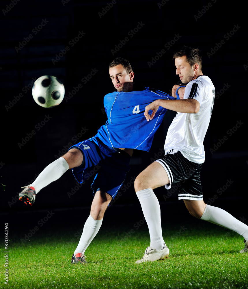 football players in action for the ball