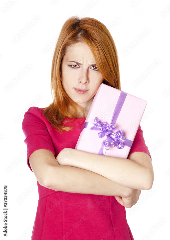 Sad red-haired girl with present box. Sad red-haired girl with present box.