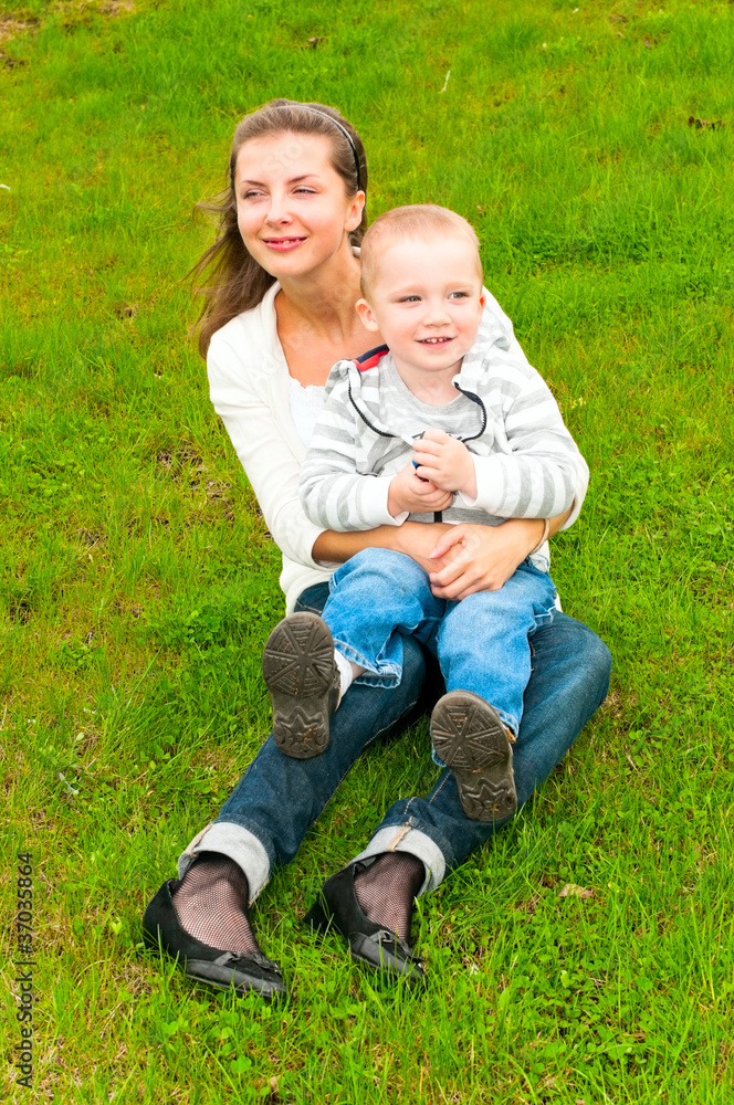 Fototapeta premium mother and child on the grass